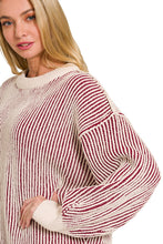 Load image into Gallery viewer, Woman wearing a red and white striped sweater with a neutral background