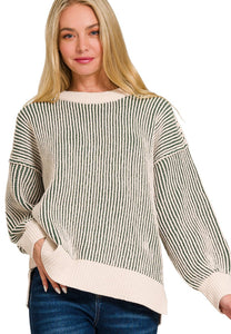 Woman wearing a striped sweater with a white background
