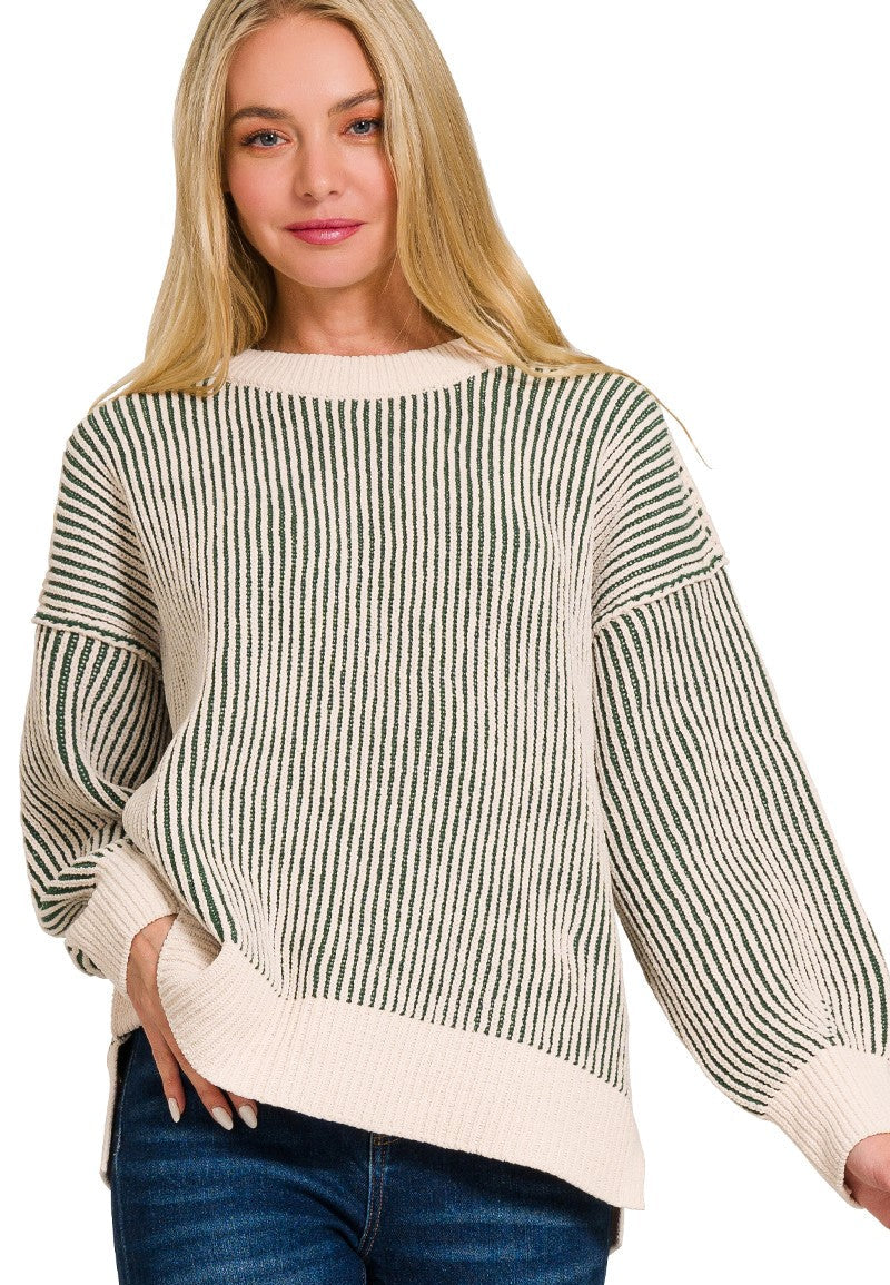 Woman wearing a striped sweater with a white background