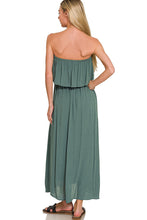 Load image into Gallery viewer, Woman wearing a strapless green dress on a white background