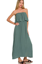 Load image into Gallery viewer, Woman wearing a strapless green dress on a white background