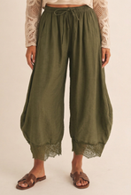 Load image into Gallery viewer, Closer view of olive balloon pants and lace hems