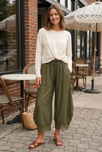 Load image into Gallery viewer, Cream front-twist sweater paired with olive lace-hem pants