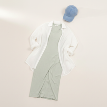Load image into Gallery viewer, Flat lay of Dusty Sage Midi Dress, white linen top, and denim cap