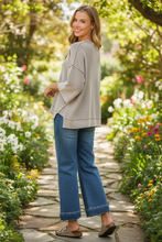 Load image into Gallery viewer, Washed 3/4 Sleeve Boxy Sweater styled with wide leg jeans and Birkenstocks - back