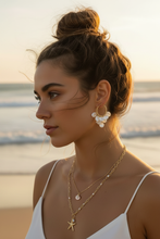 Load image into Gallery viewer, Model wearing Starfish &amp; Pearl Pendant Layered Necklace with Pearl Petal Charm Hoop Earrings, beachy coastal setting