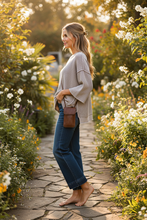 Load image into Gallery viewer, Washed 3/4 Sleeve Boxy Sweater styled with wide leg jeans and phone bag - side
